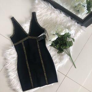 Black mini bandage dress with gold detailing